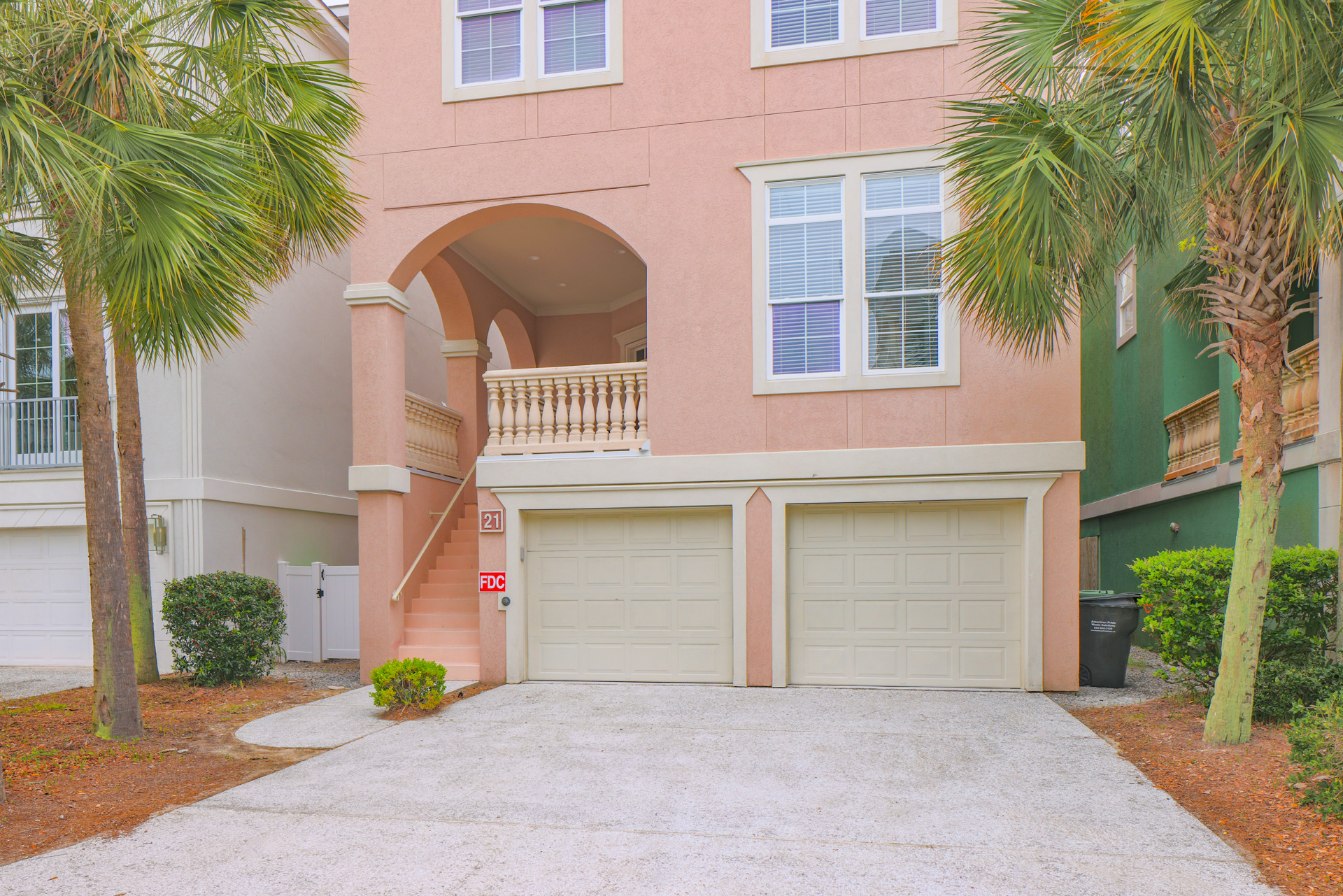 Front entry with arched portico and double garage