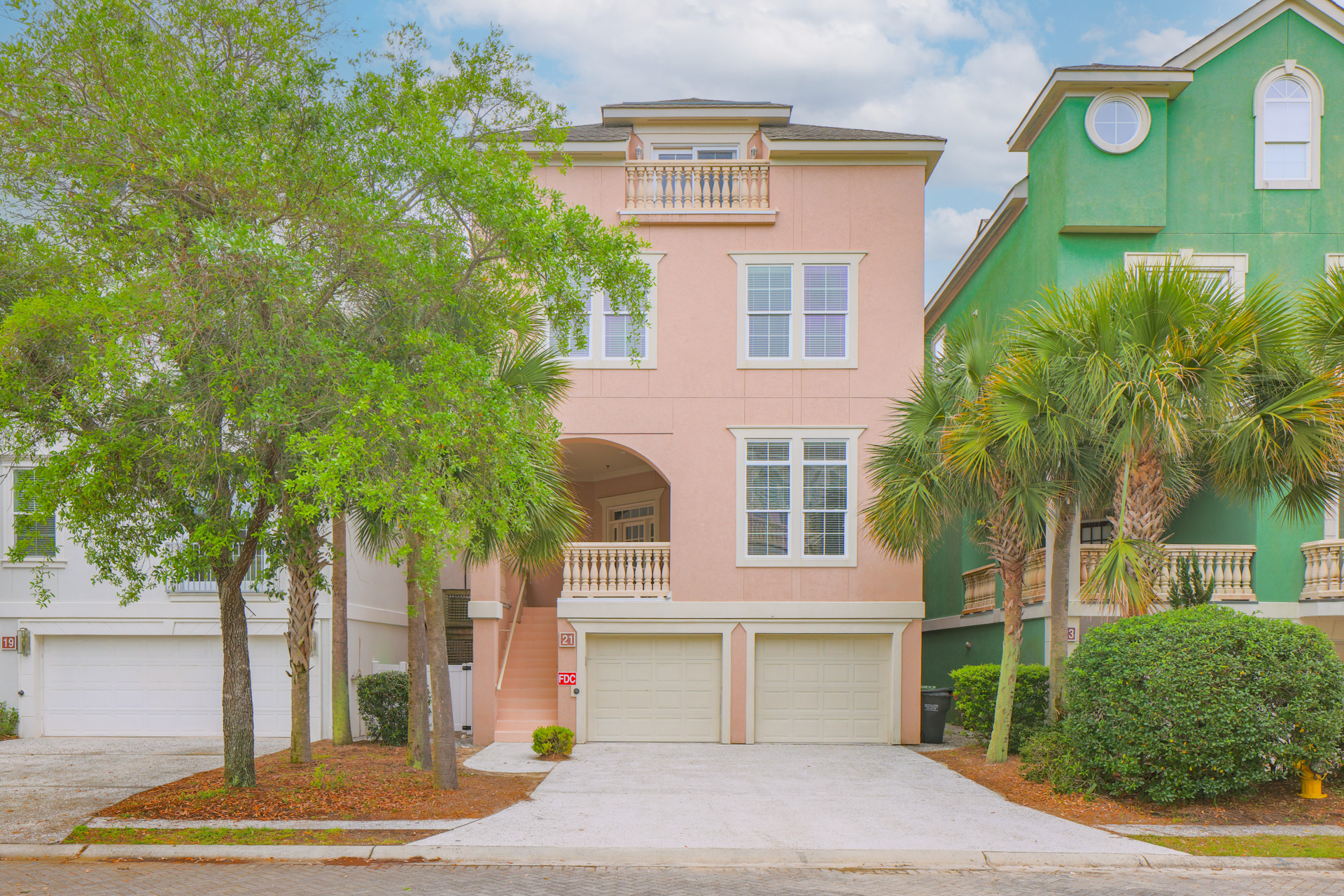 21 Crabline Court — 3-story exterior with palm trees and double garage